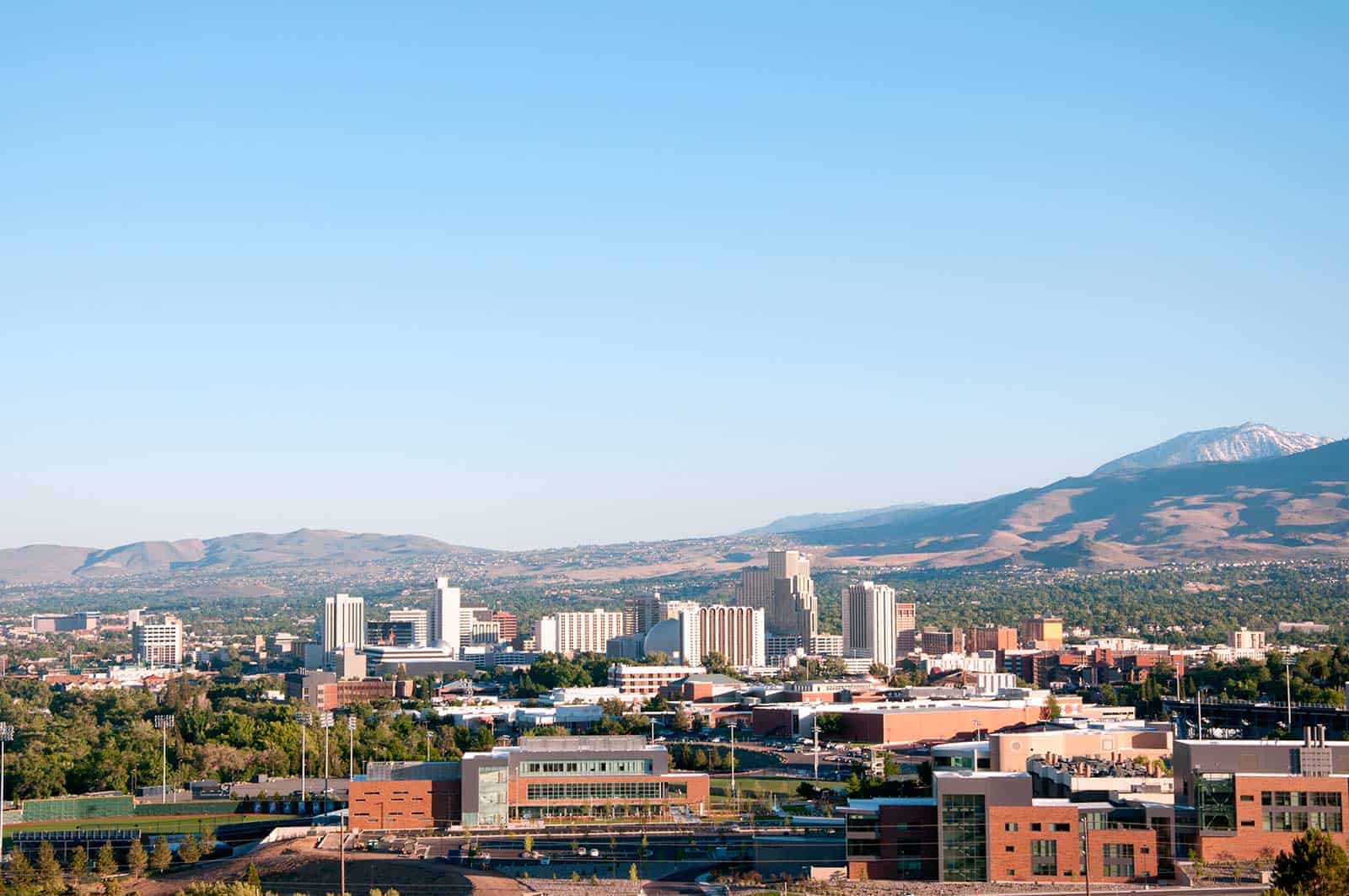 The Reno Nevada skyline with the Sierra Nevada mountains behind it